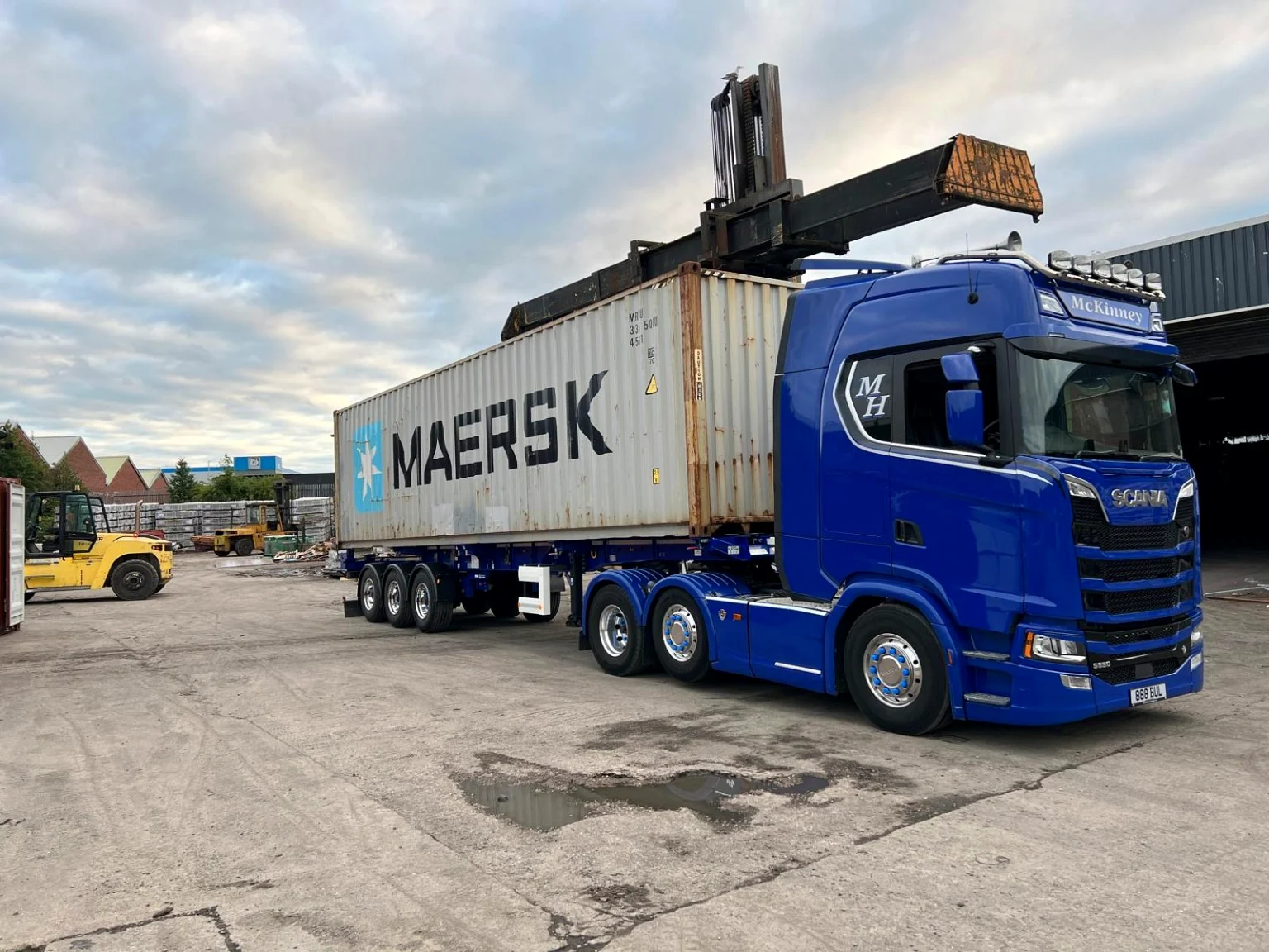 McKinney Haulage skeletal trailer carrying a shipping container